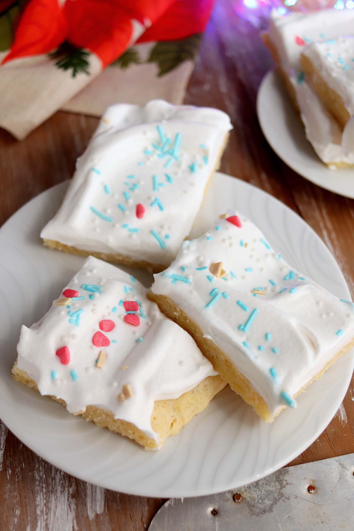 holiday sugar cookie bars on a plate.
